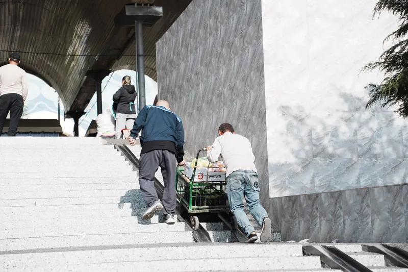 Laborers at metro entrance